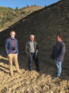 Alexandre (centre) and Arlindo (right) lend scale to the rampart-like dry stone walls supporting the terraces.